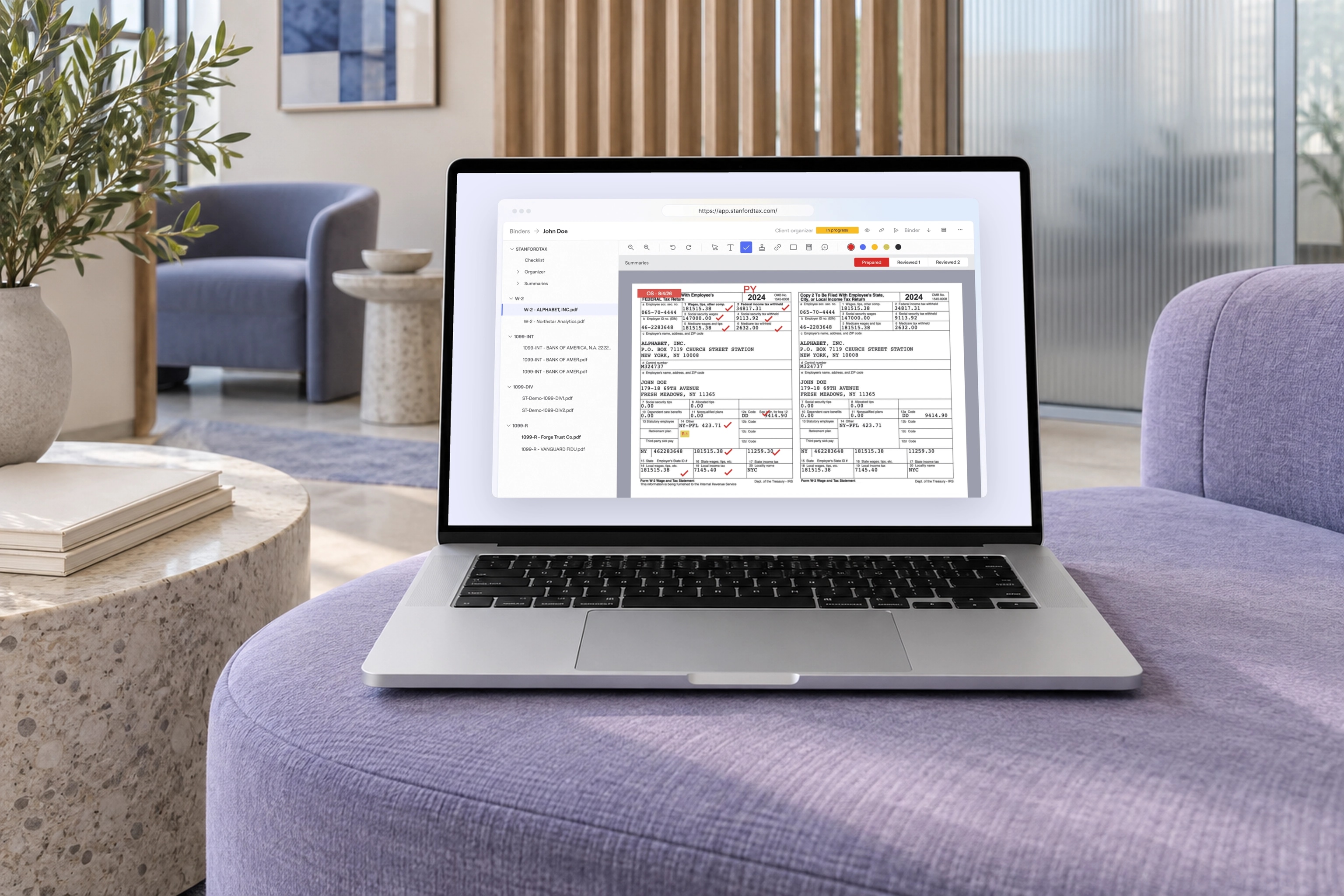 The real StanfordTax workpaper review interface on a MacBook in a scene created for the case study.